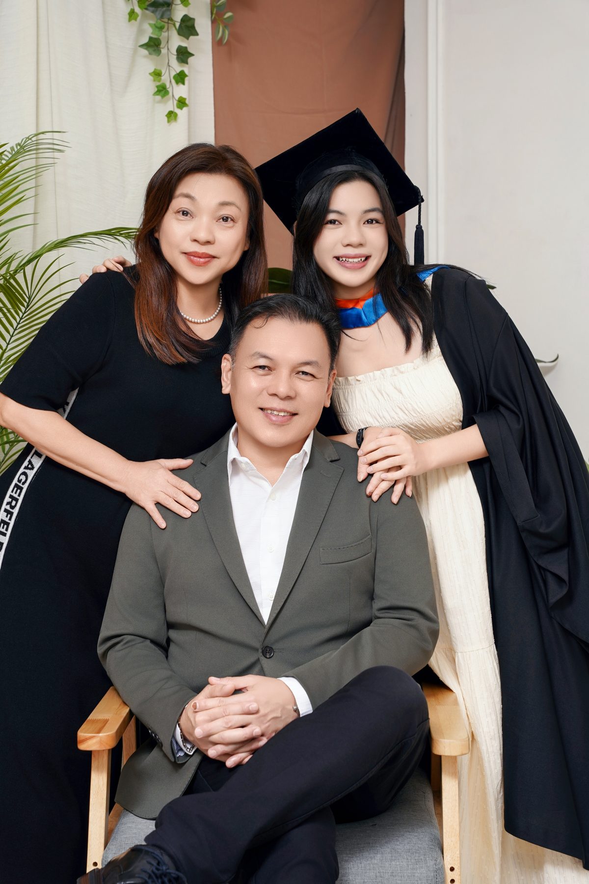 Premo Studio real client graduation photo — three generations celebrating graduation