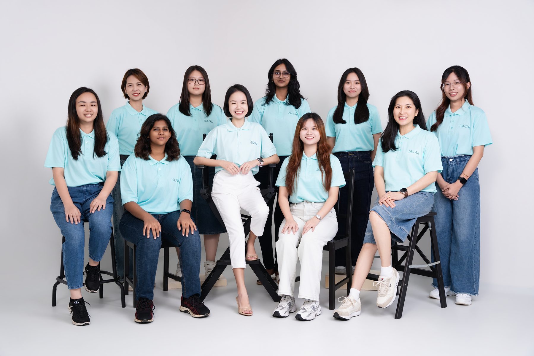 Premo Studio real client business portrait — 12-person company team group photo