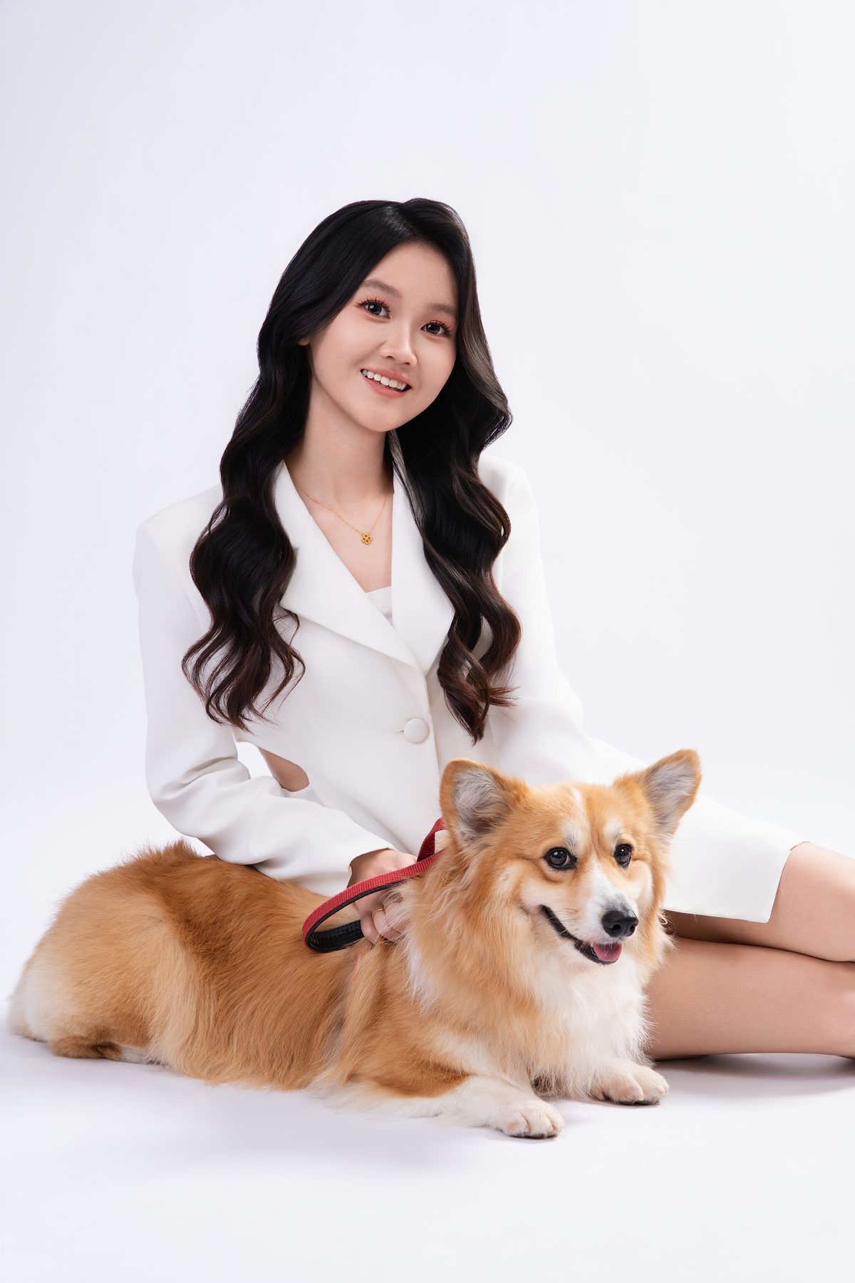 Premo Studio real client business portrait — woman with pet corgi, lifestyle style