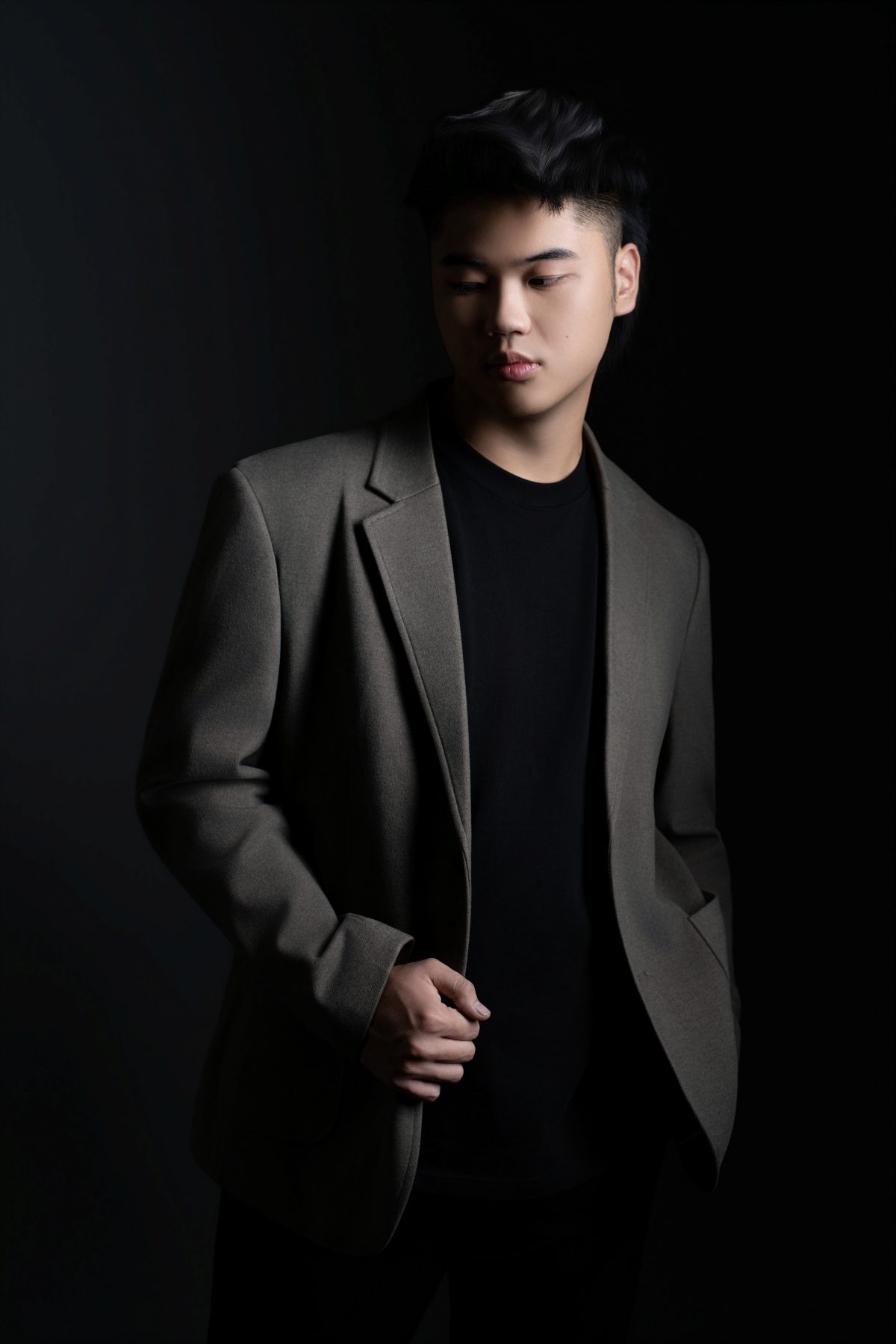 Premo Studio real client business portrait — young man in blazer, studio portrait