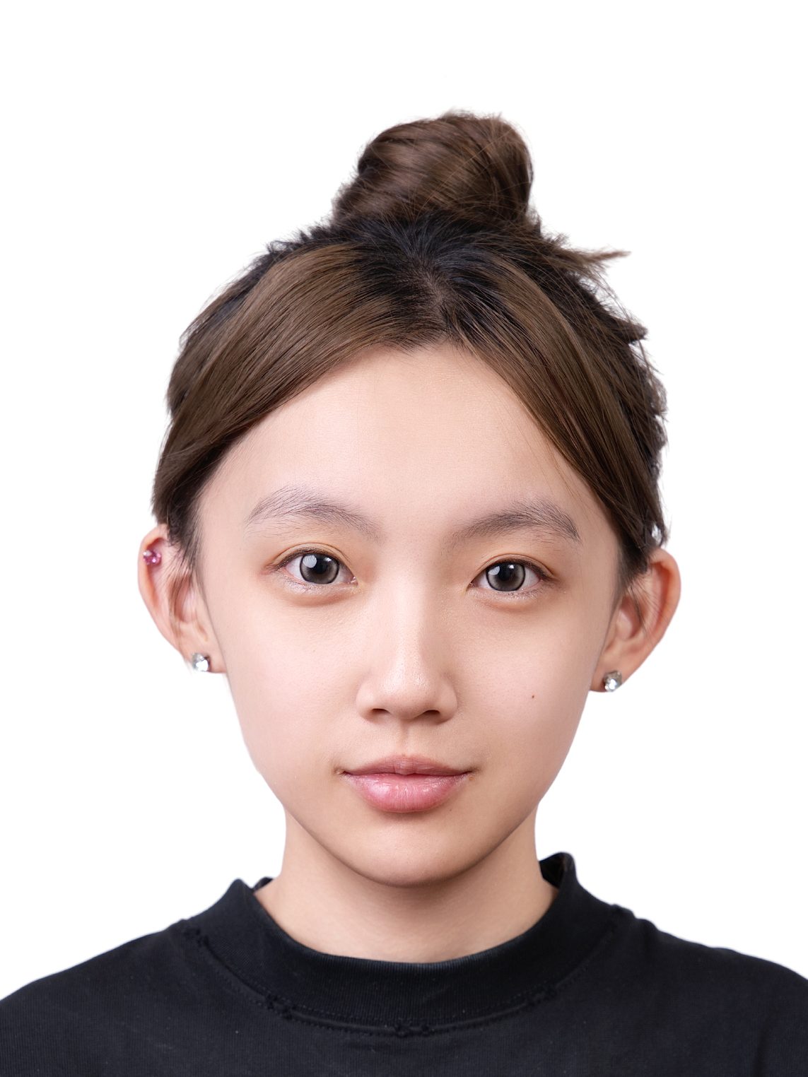 Premo Studio real client passport photo — young woman, white background